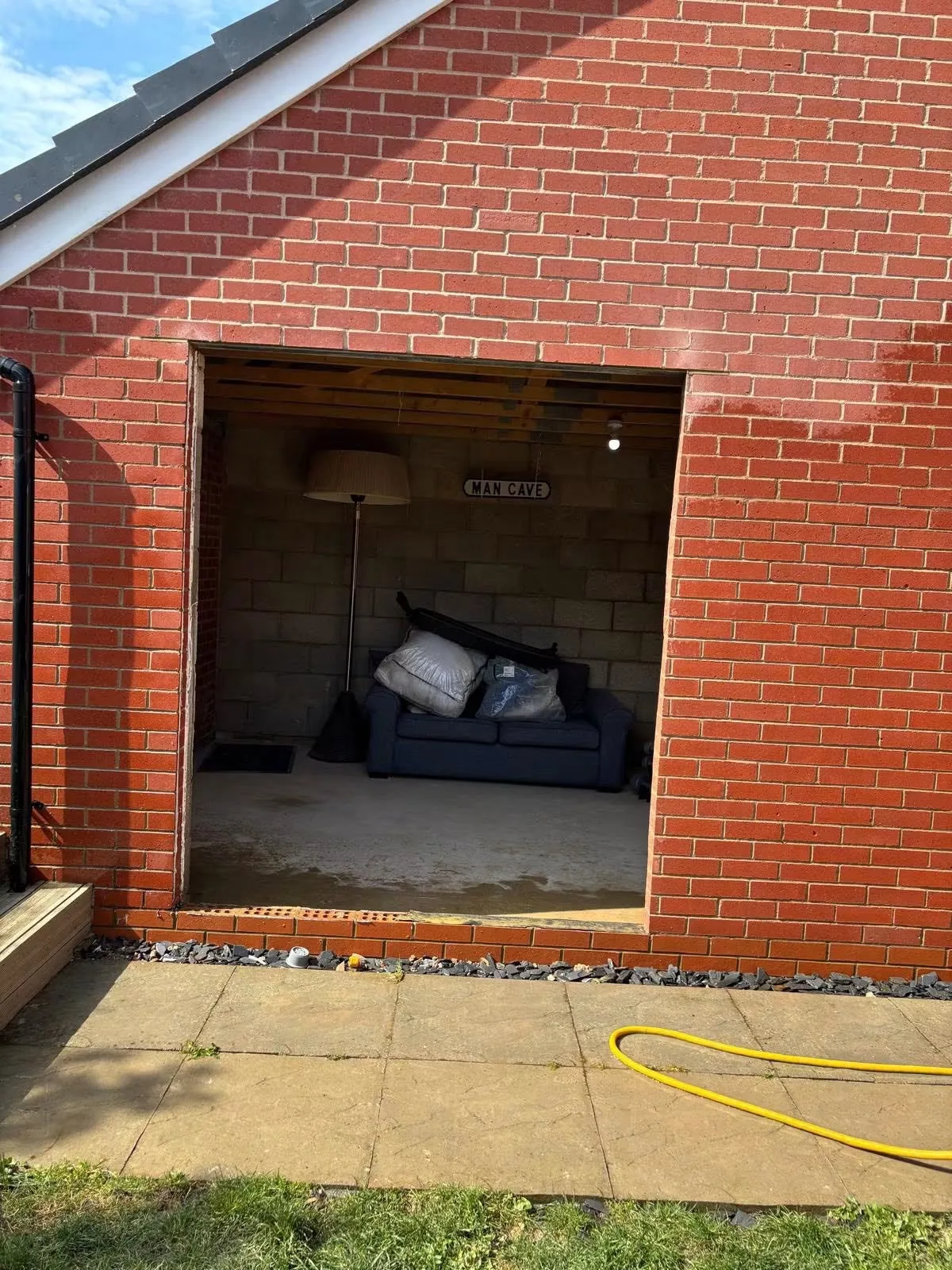New access opening formed in the brick wall of a detached garage