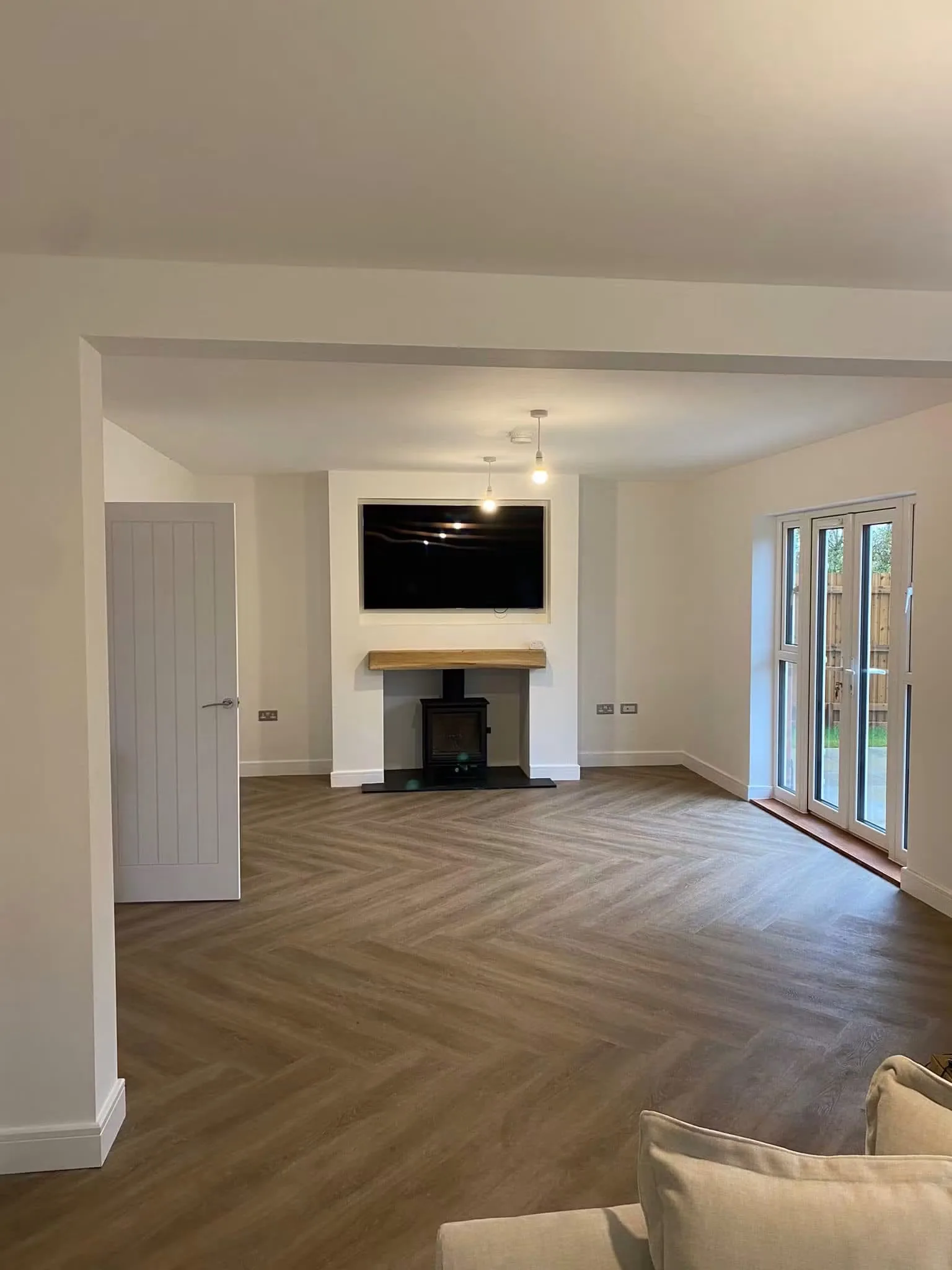 Completed open-plan living space following a structural wall alteration
