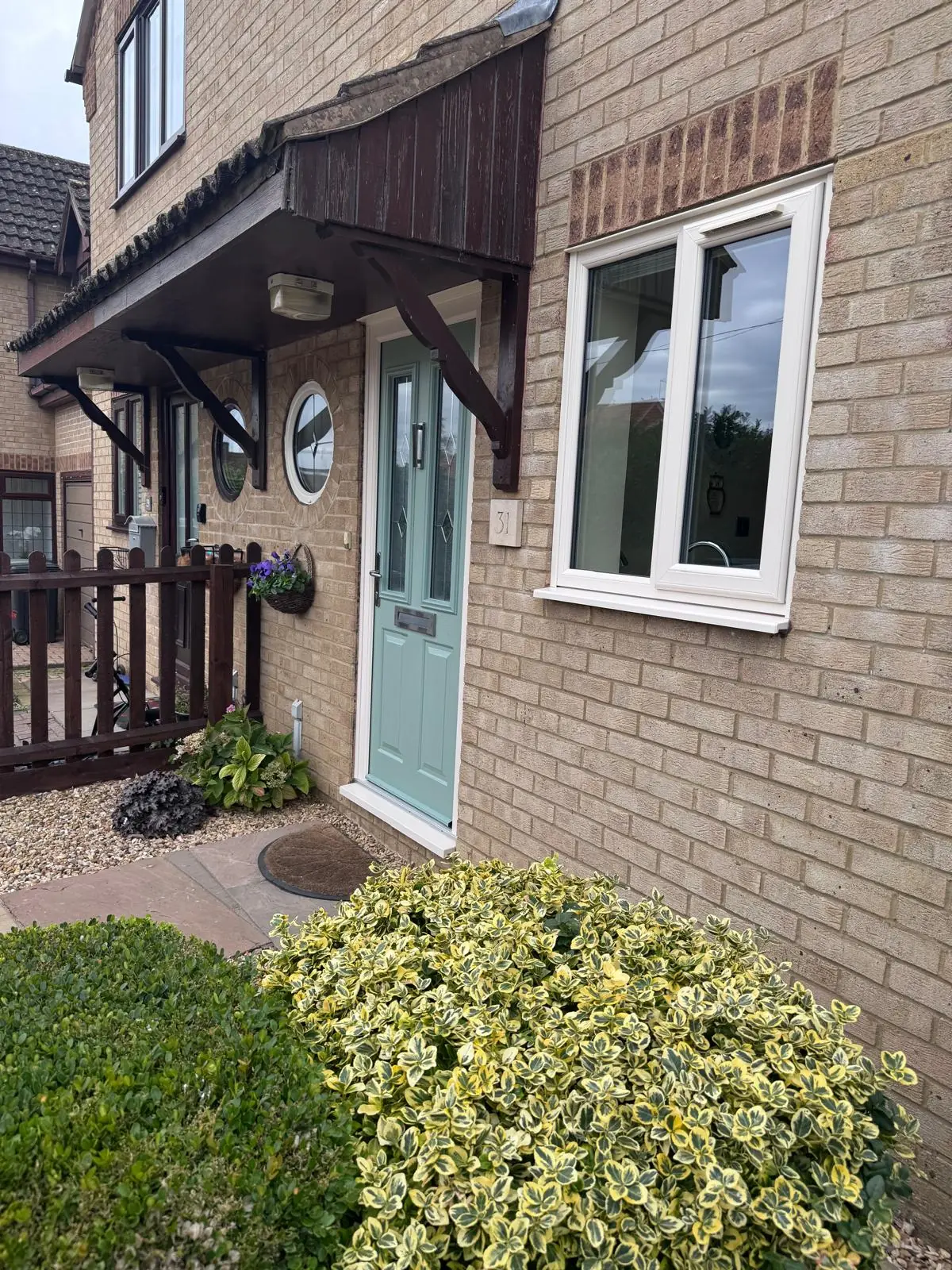 Brigstock home after installation of fresh white casement windows