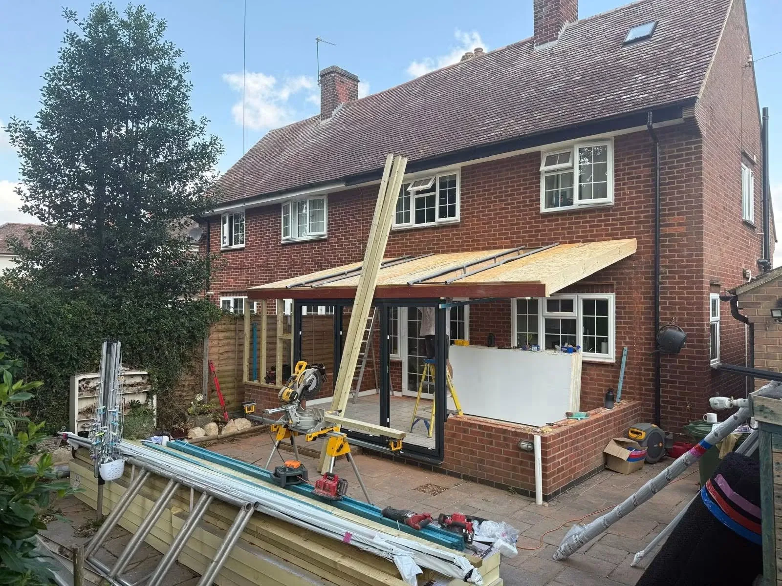 East Carlton conservatory during construction with the new pitched roof structure being installed