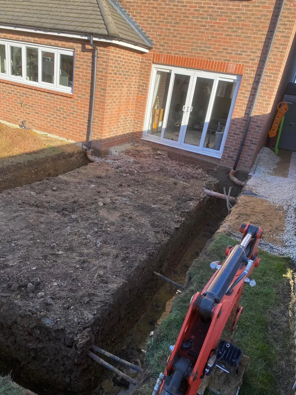 Foundation trenches excavated for the new single-storey extension
