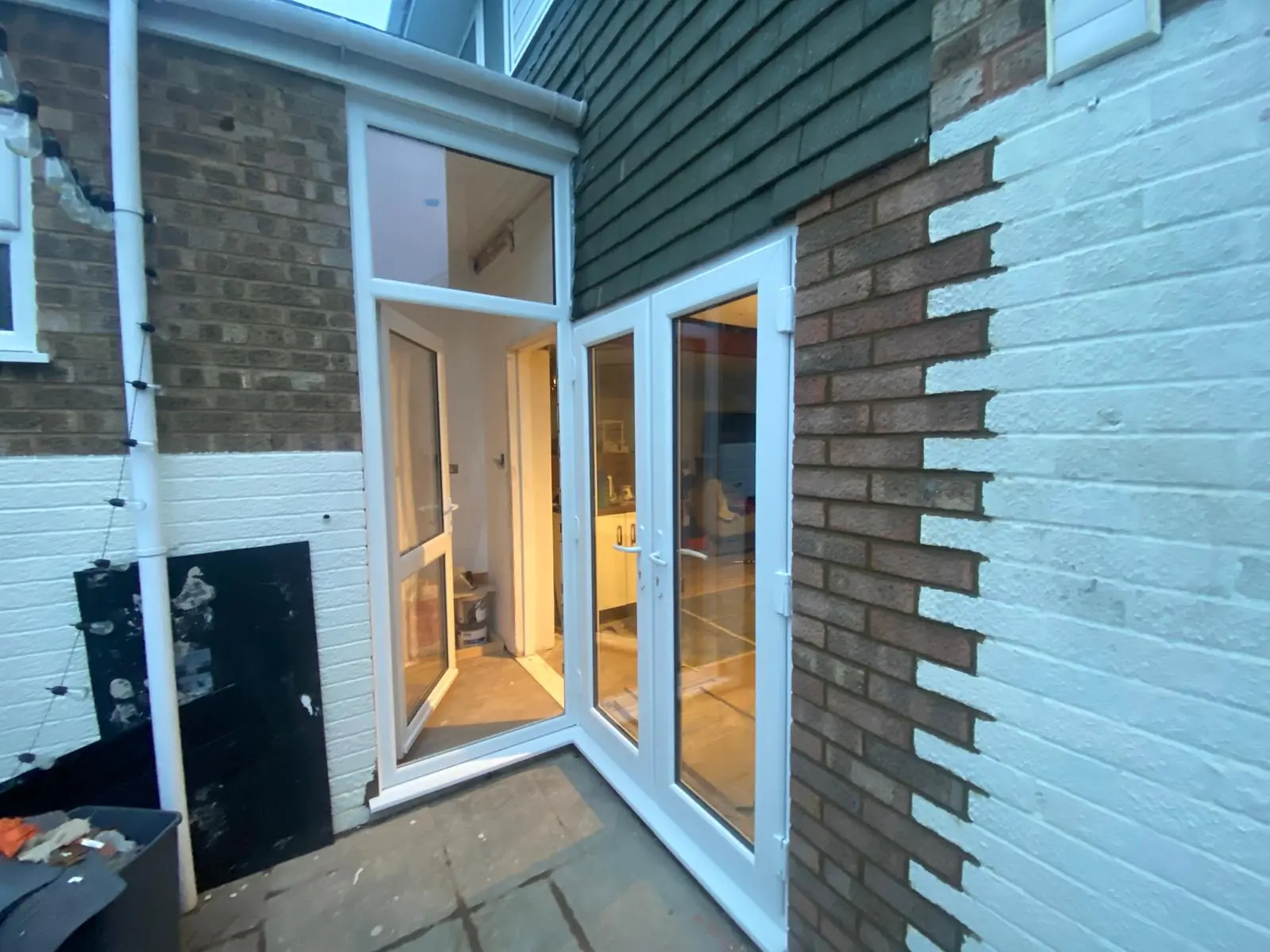 Rothwell kitchen after installation of white PVCu French doors