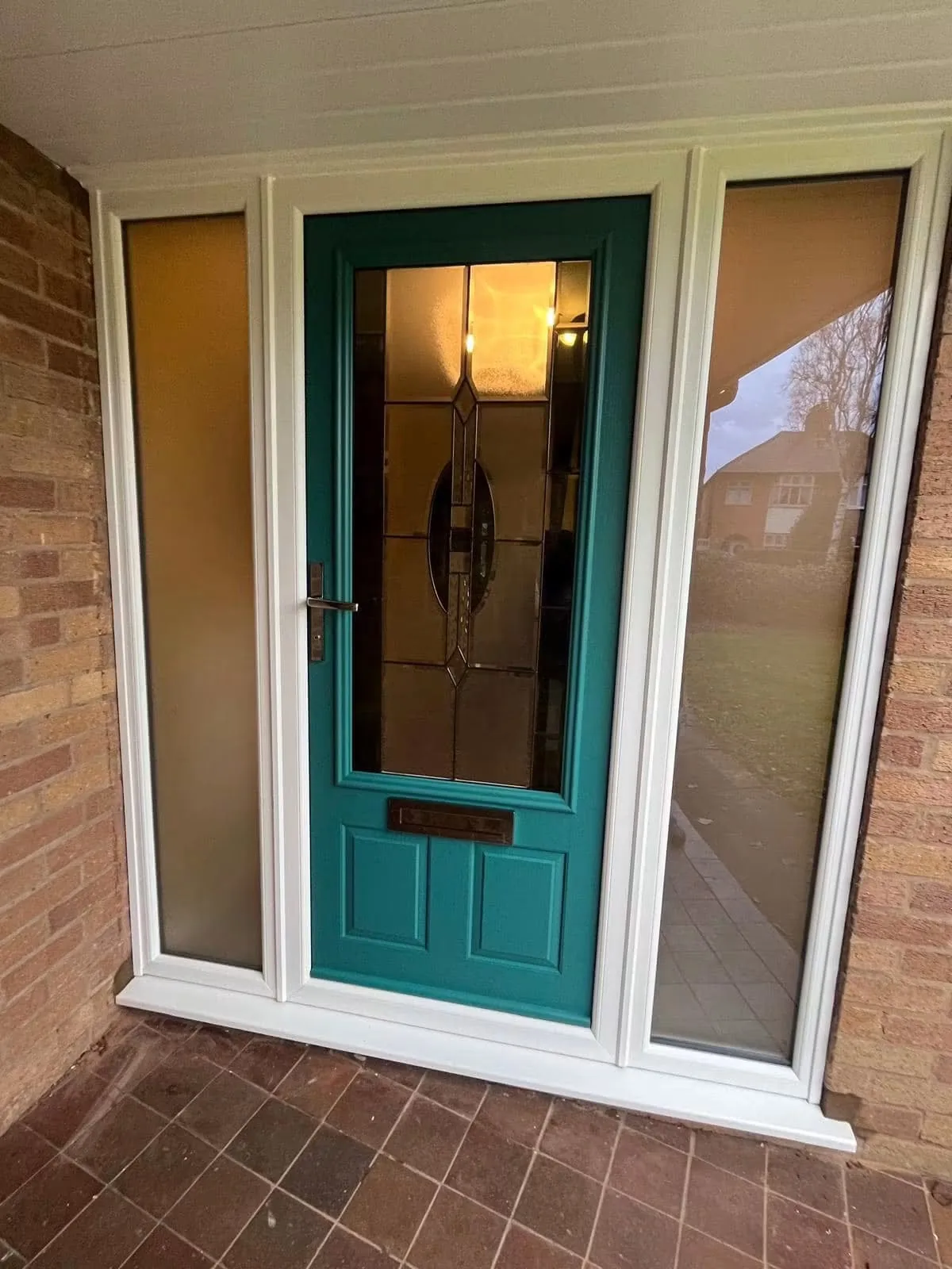 Entrance door with matching glazed side panels