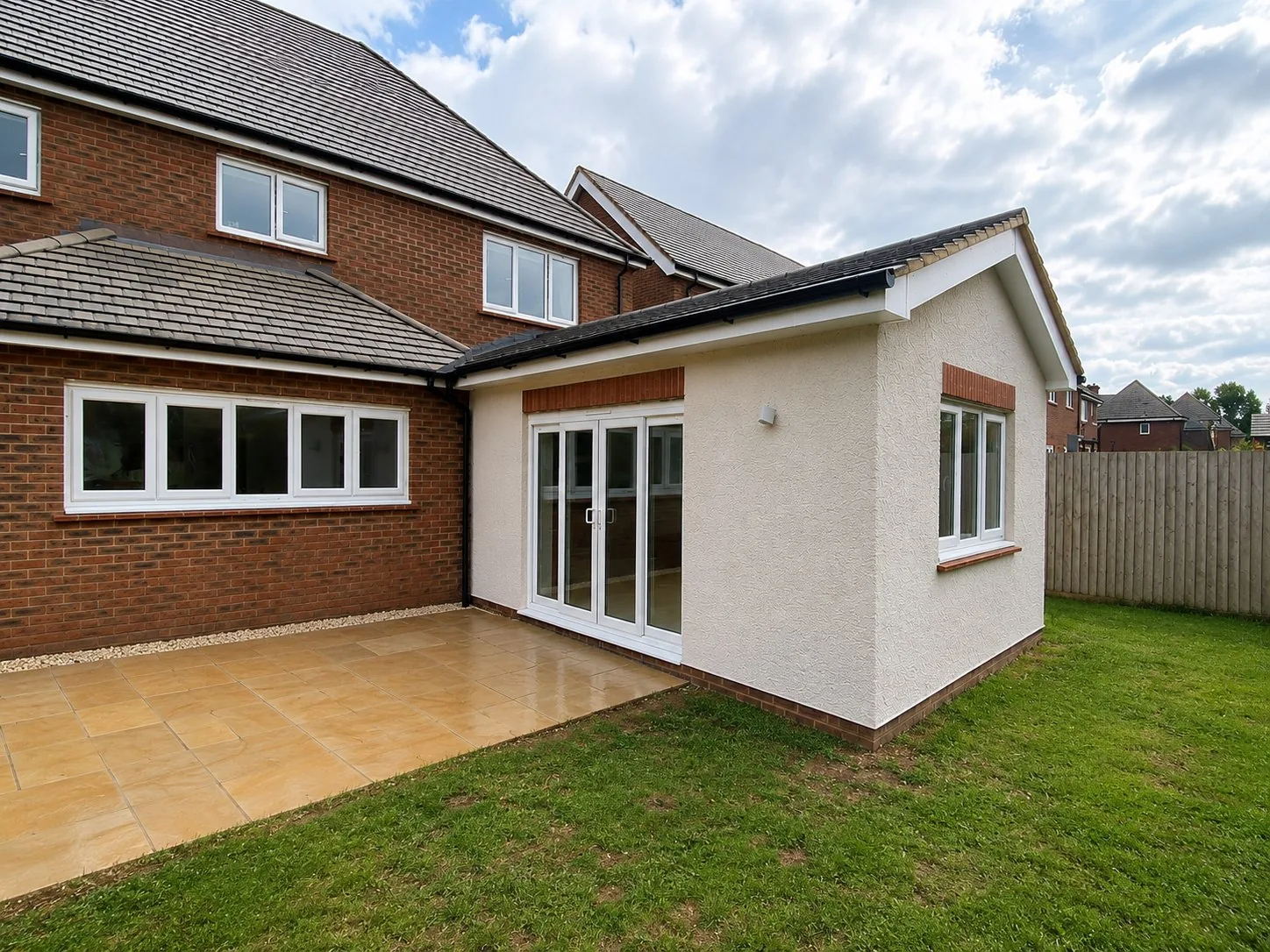 Completed rendered single-storey extension providing additional living space in Leicestershire