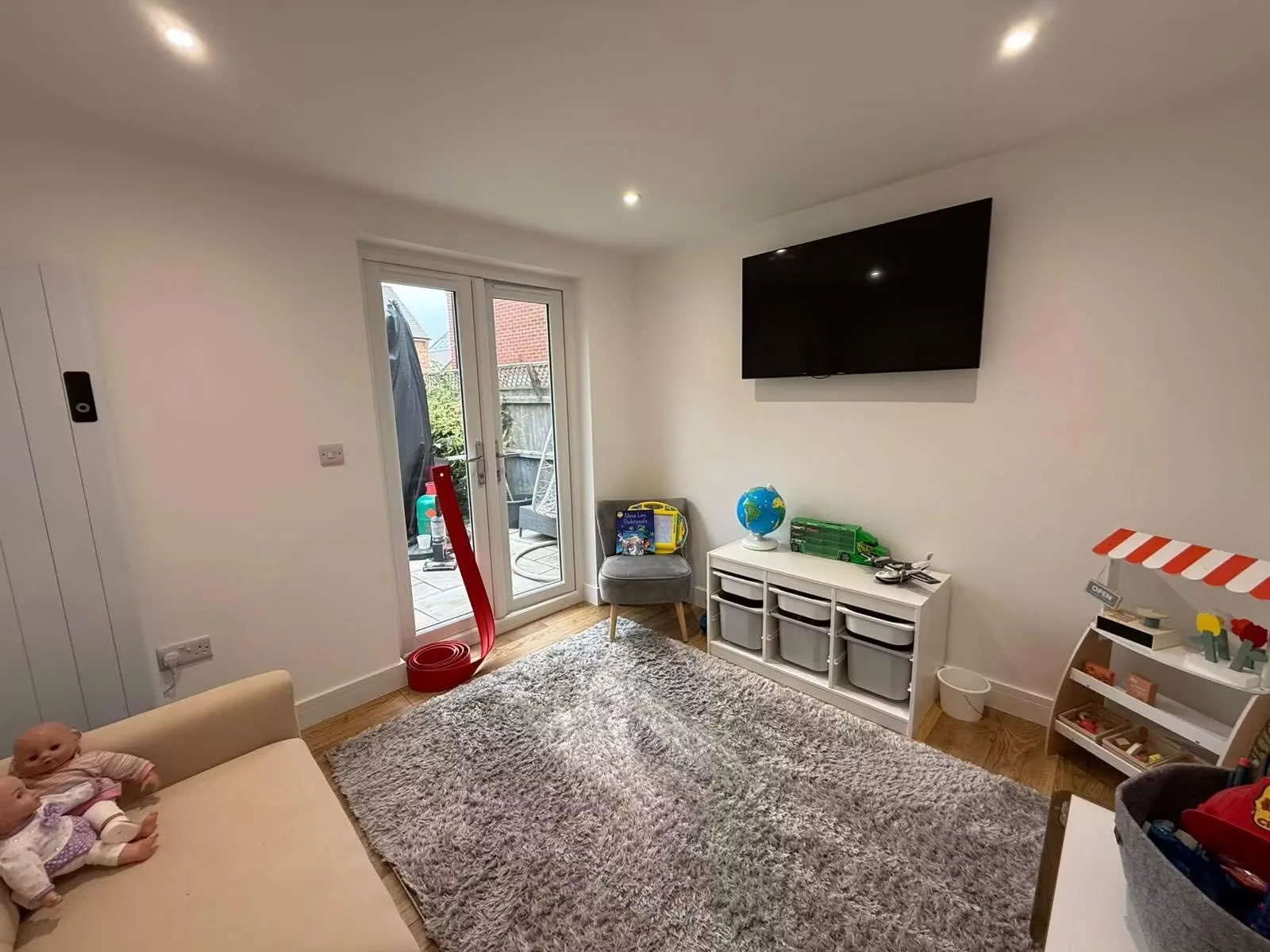 Finished garage conversion used as a bright children's playroom