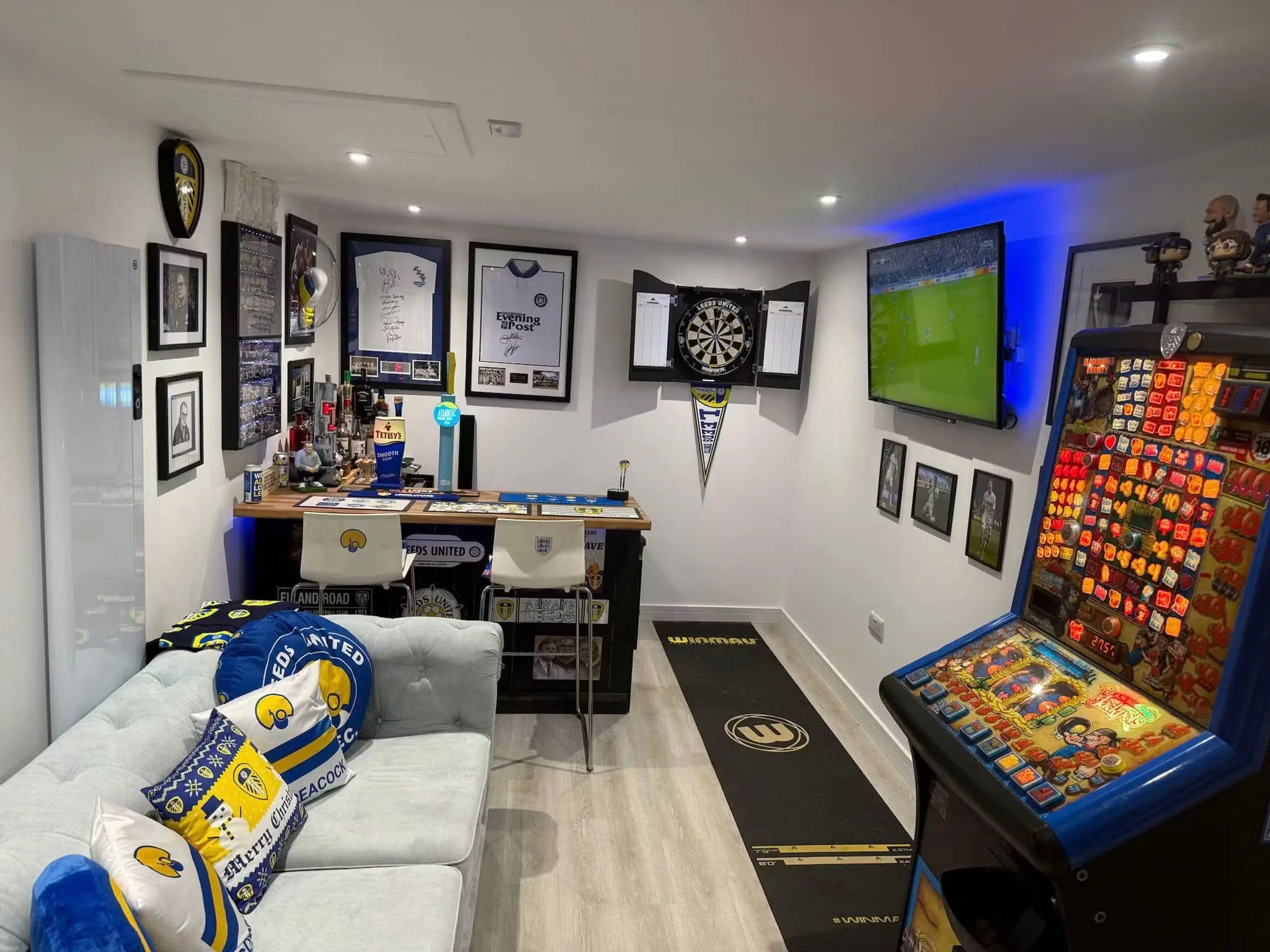 Finished garage conversion fitted out as a sports room and home bar